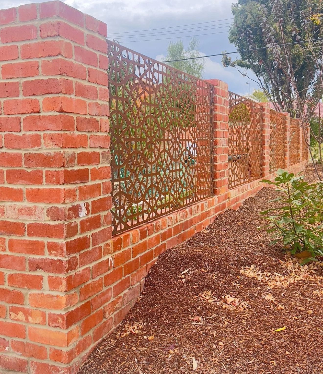 Brick fence with decorative infill on a Canberra property